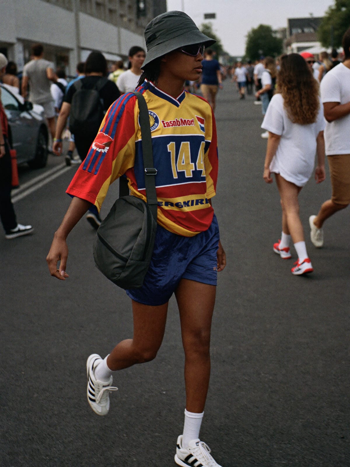 Jersey Core outfit for Amsterdam Dance Event: retro football or racing jersey, mesh or nylon shorts, terrace trainers