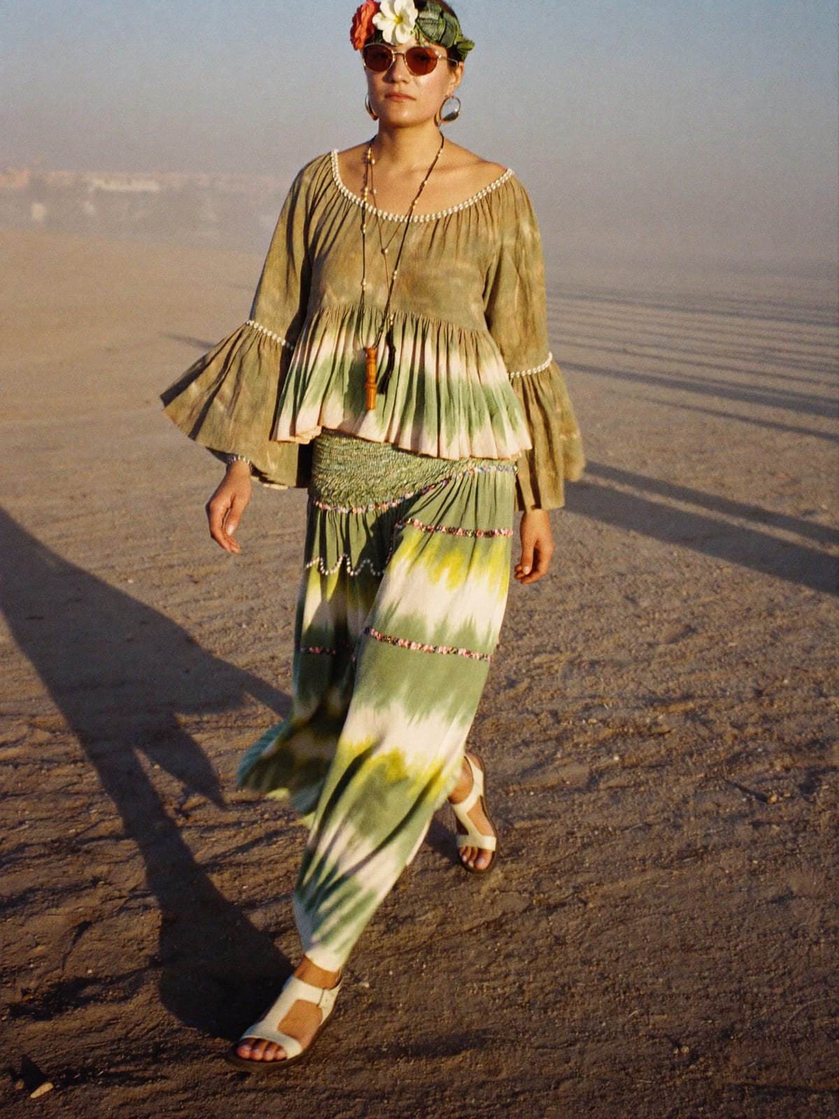 Flower Power outfit for Burning Man: tie-dye or paisley maxi, bell-sleeve blouse, flat leather sandals
