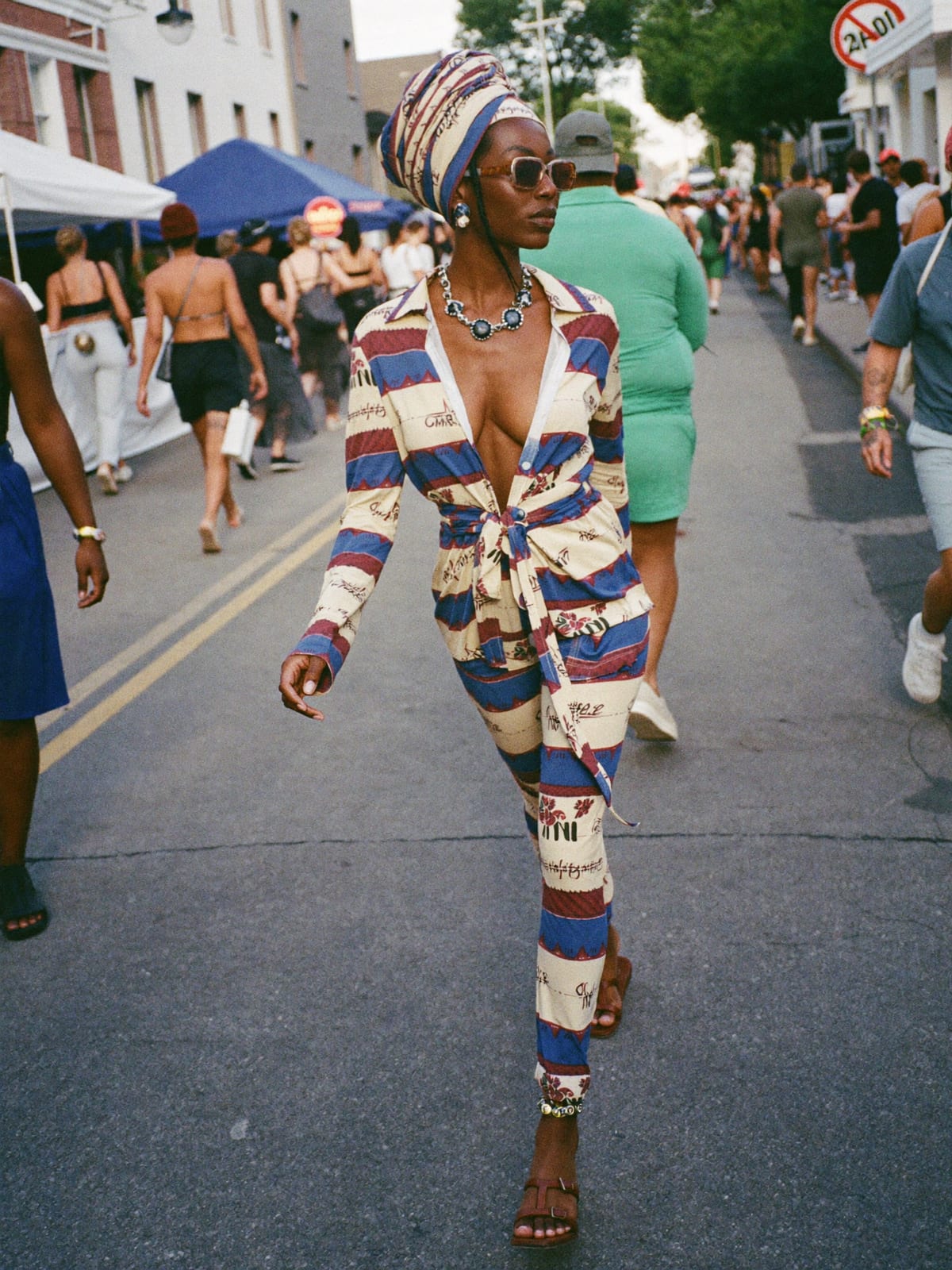 Afro Print Statement outfit for Calgary Stampede: printed co-ord set, open shirt or wrap top, leather sandals or slides