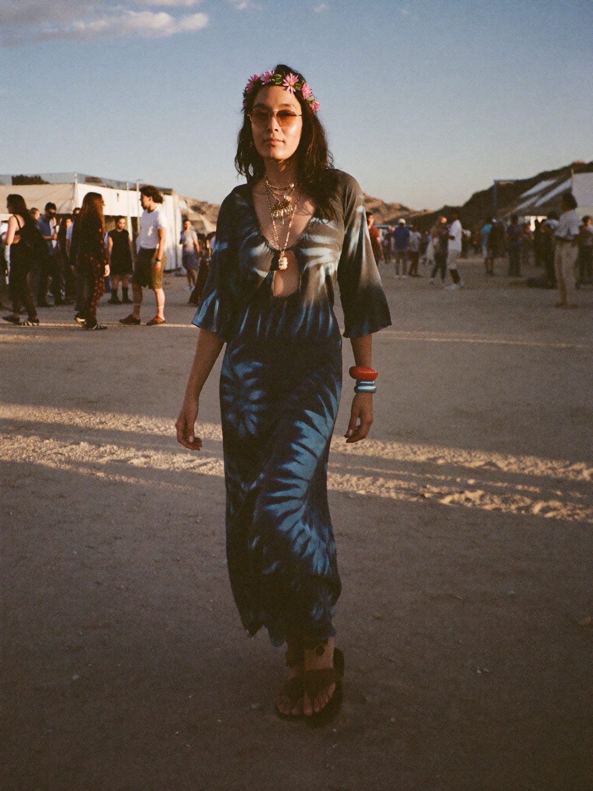 Flower Power outfit for Coachella: tie-dye or paisley maxi, bell-sleeve blouse, flat leather sandals