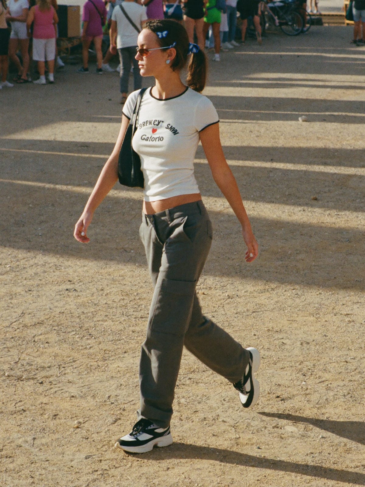 Y2K Revival outfit for Coachella: baby tee or halter top, low-rise cargo or micro mini, chunky retro trainers