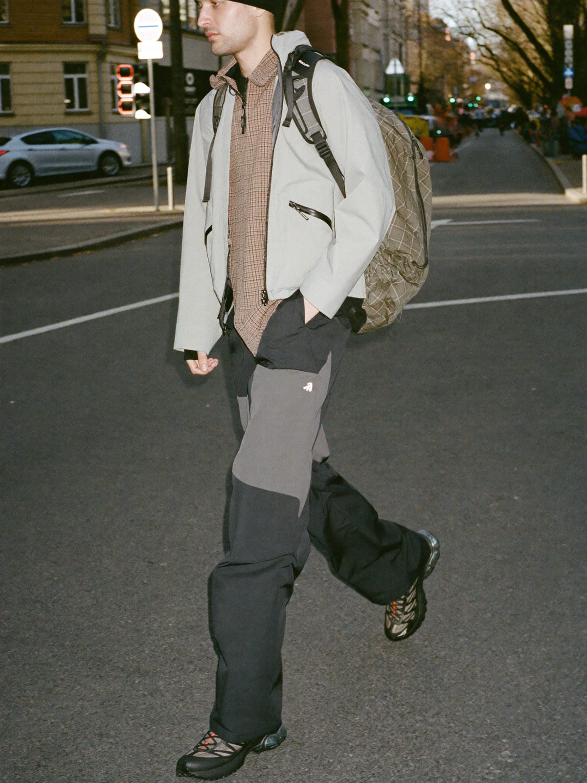 Gorpcore Utility outfit for Cologne Carnival: technical waterproof shell, utility trousers, trail runners