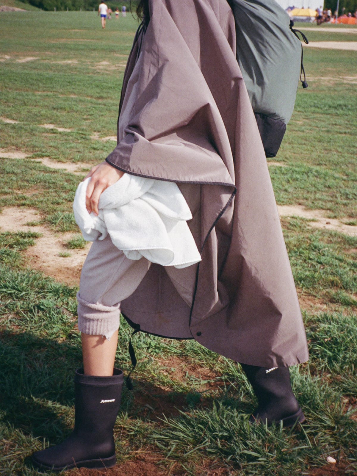 Mud-Proof Practical outfit for Electric Castle: waterproof poncho, wellington boots with thick socks, fleece mid-layer