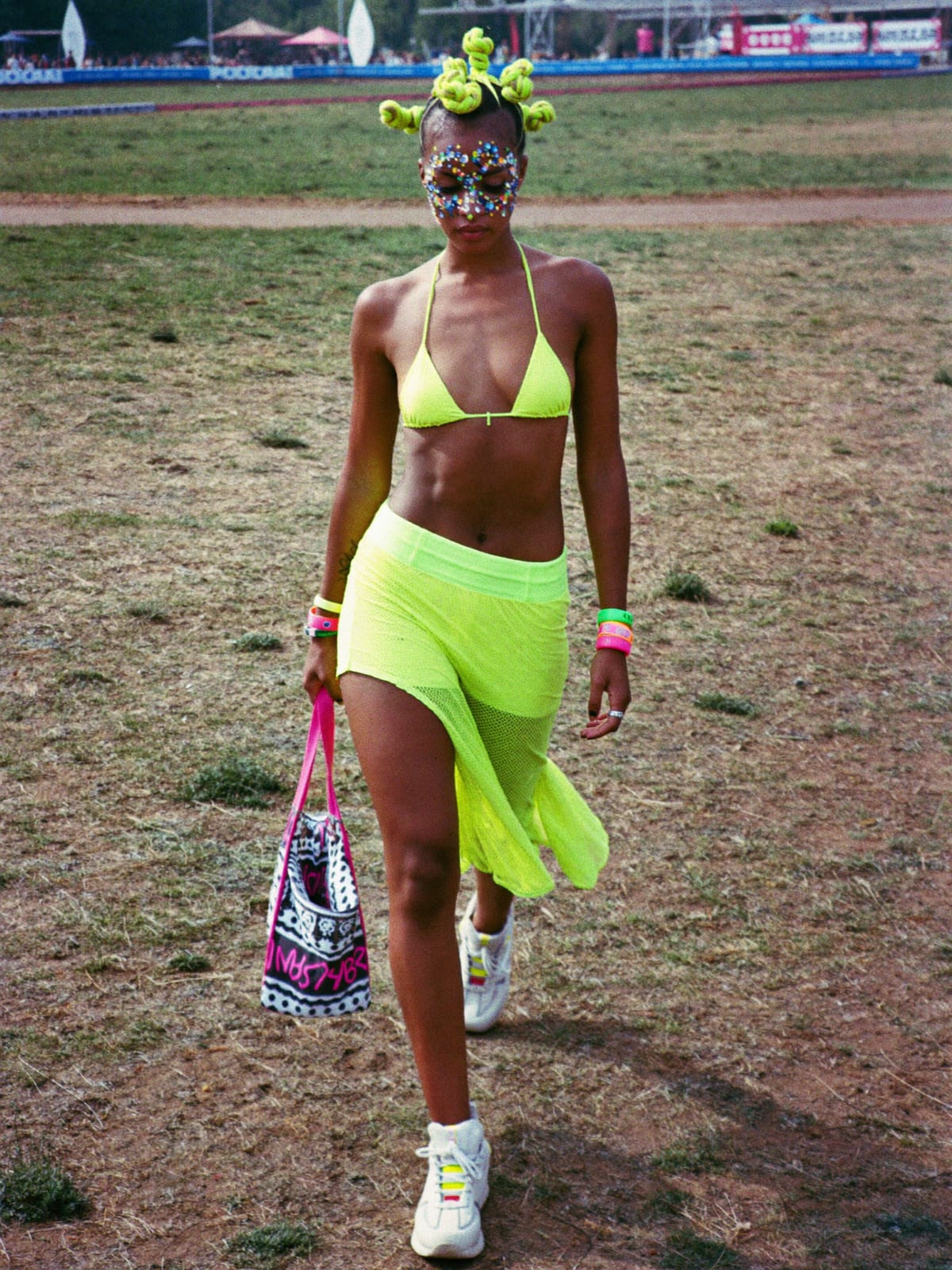 Neon Rave outfit for Electric Castle: UV-reactive bikini top or bodysuit, neon shorts or mesh skirt, chunky white trainers