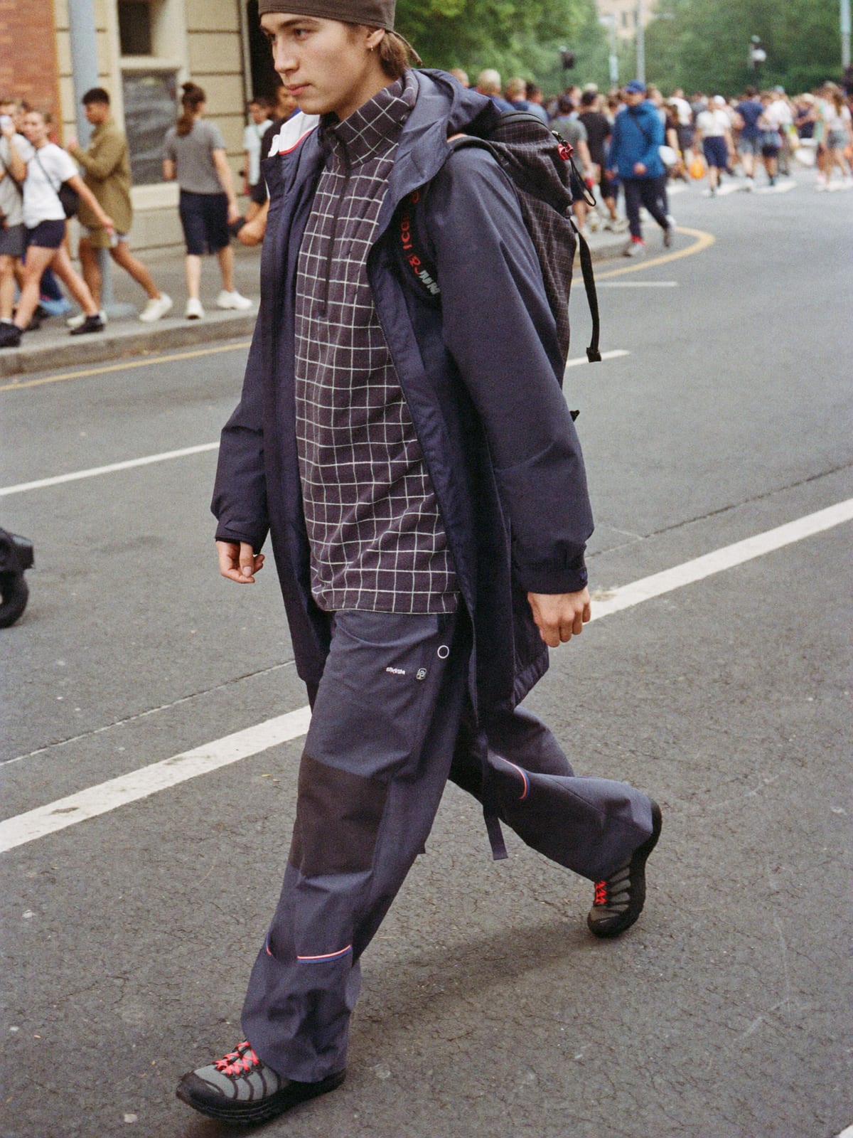 Gorpcore Utility outfit for EXIT Festival: technical waterproof shell, utility trousers, trail runners