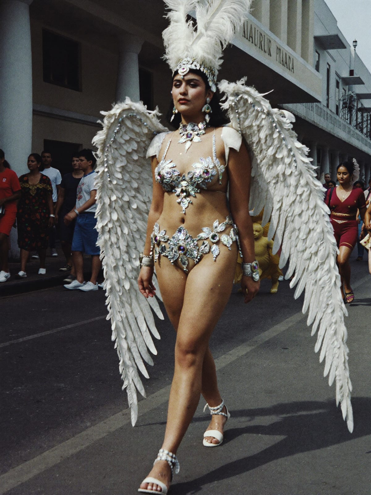 Carnival Feathers outfit for Holi in Mathura: feather headpiece and wings, sequin bodysuit, body gems and glitter
