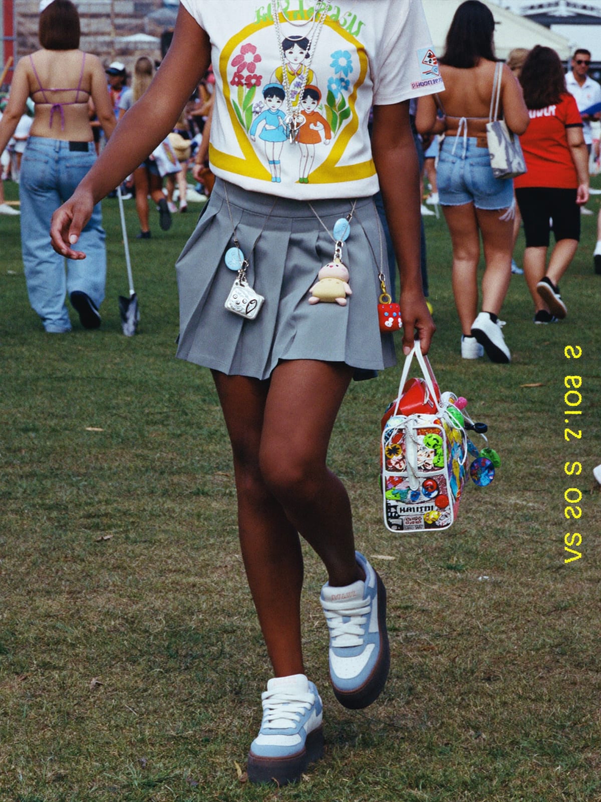 Kawaii Layer outfit for Lollapalooza: pleated skirt set, graphic layering tee, platform sneakers