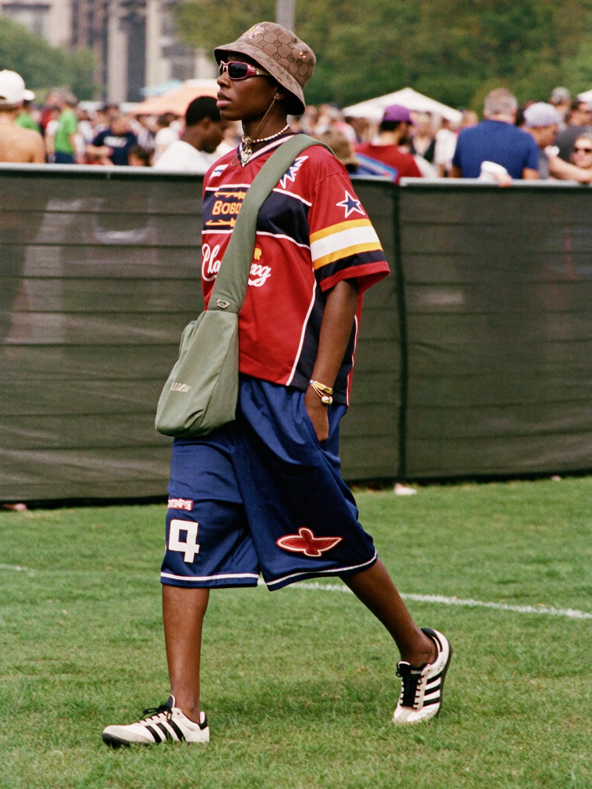 Jersey Core outfit for Lollapalooza: retro football or racing jersey, mesh or nylon shorts, terrace trainers