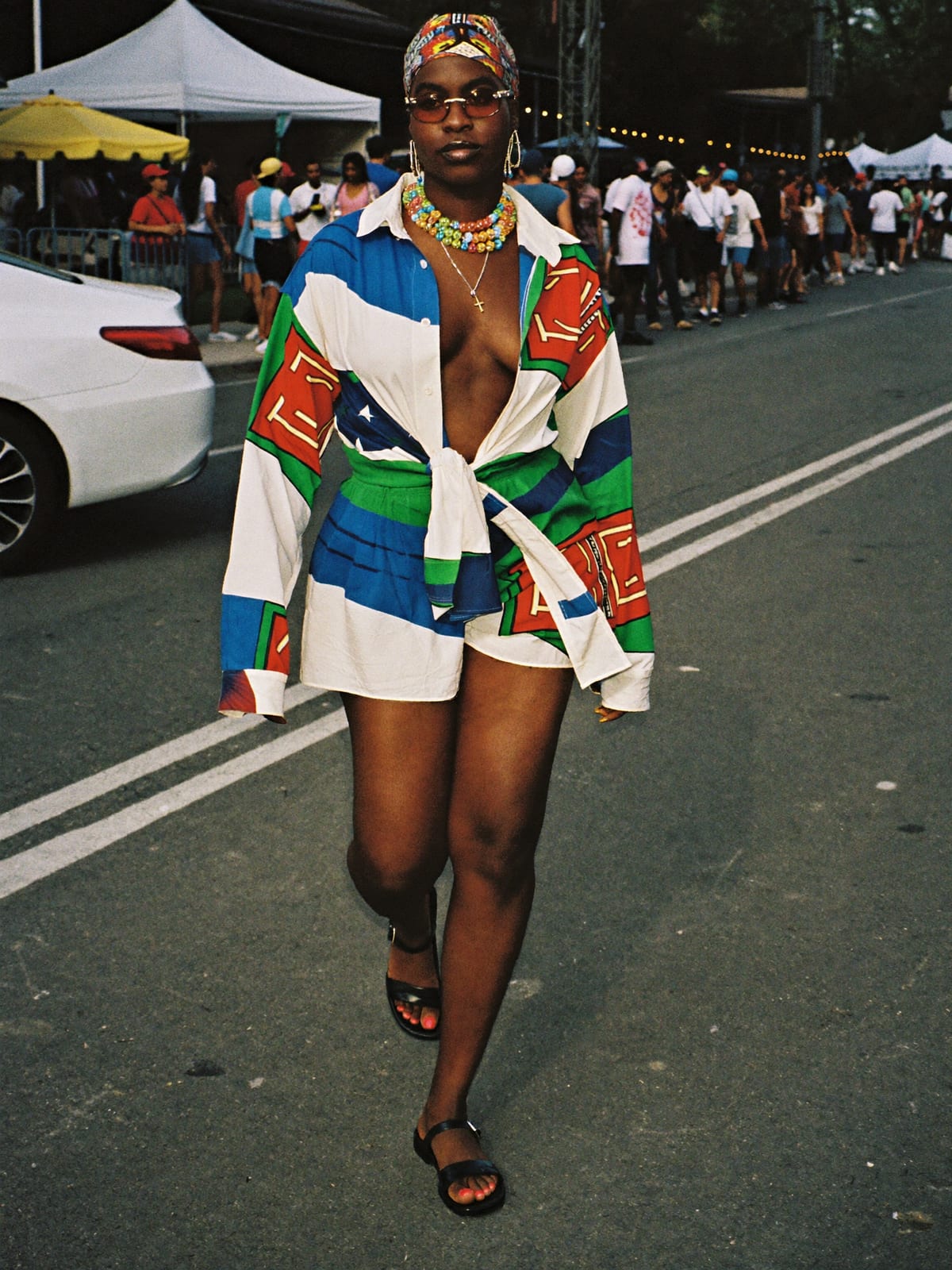 Afro Print Statement outfit for Mardi Gras New Orleans: printed co-ord set, open shirt or wrap top, leather sandals or slides