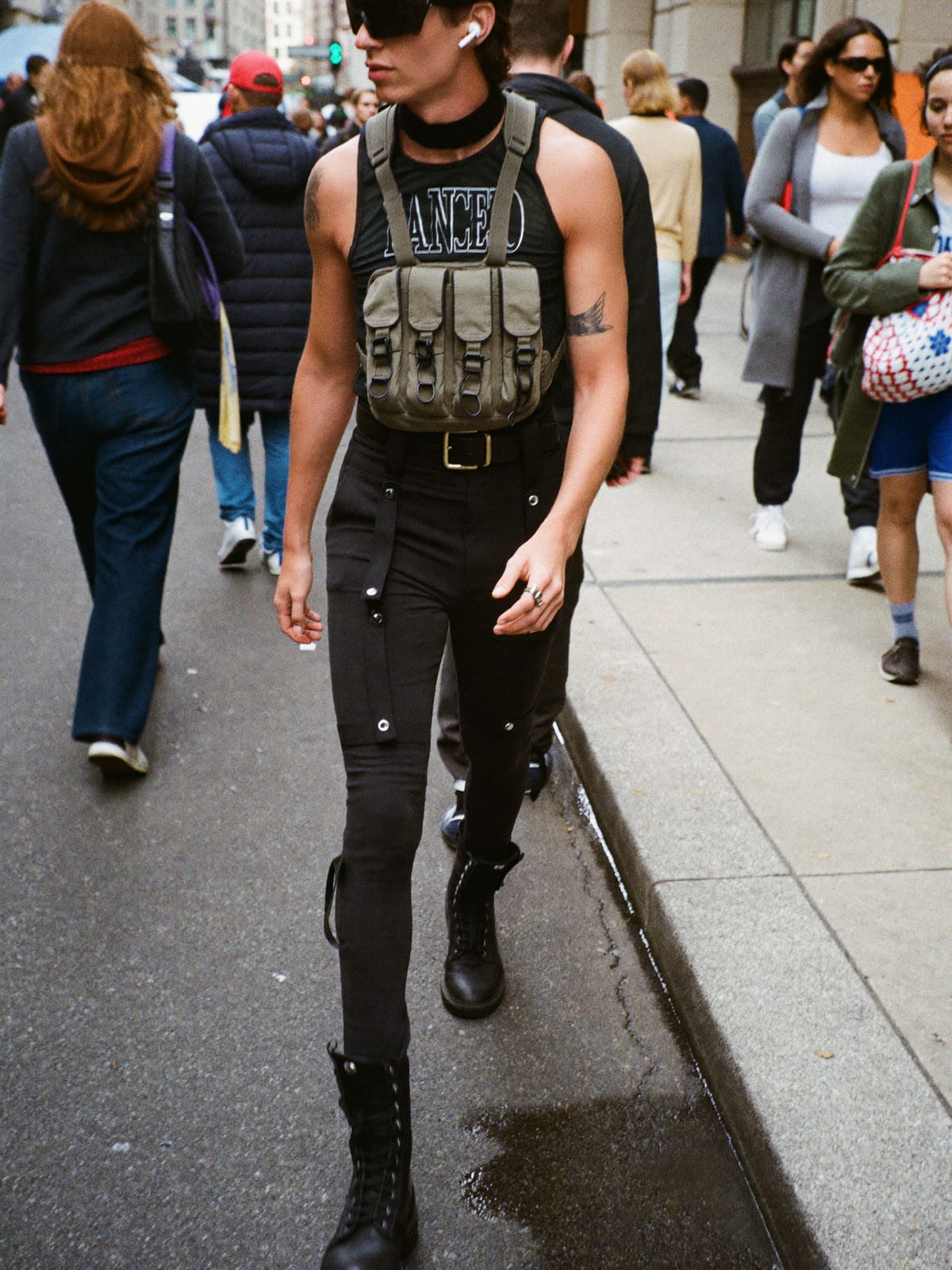 Cyberpunk Utility outfit for Mardi Gras New Orleans: technical vest or shell, strap cargo trousers, tactical boots