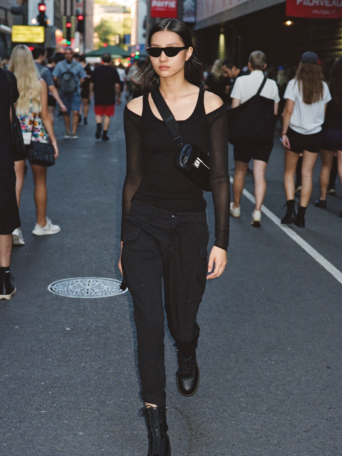 All-Black Techno outfit for Mardi Gras New Orleans: black tank or mesh long sleeve, black cargo trousers, black combat boots
