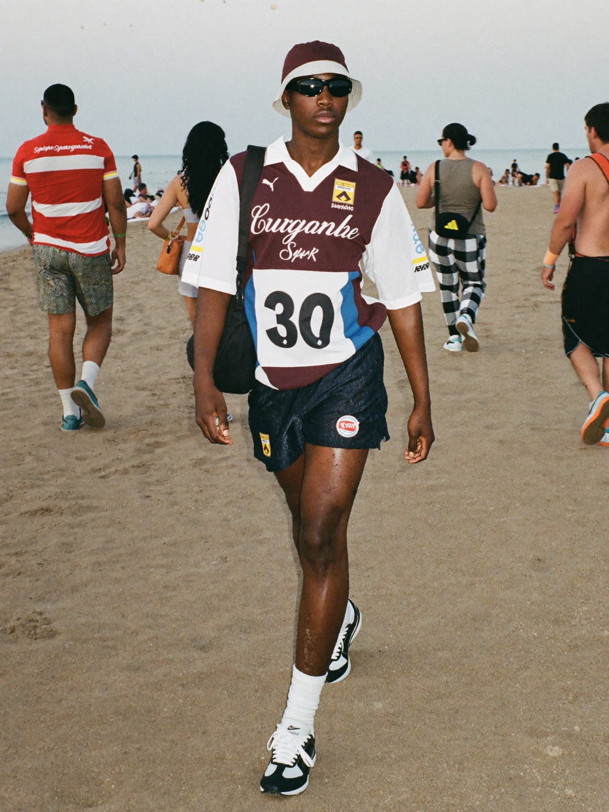Jersey Core outfit for Medusa Festival: retro football or racing jersey, mesh or nylon shorts, terrace trainers