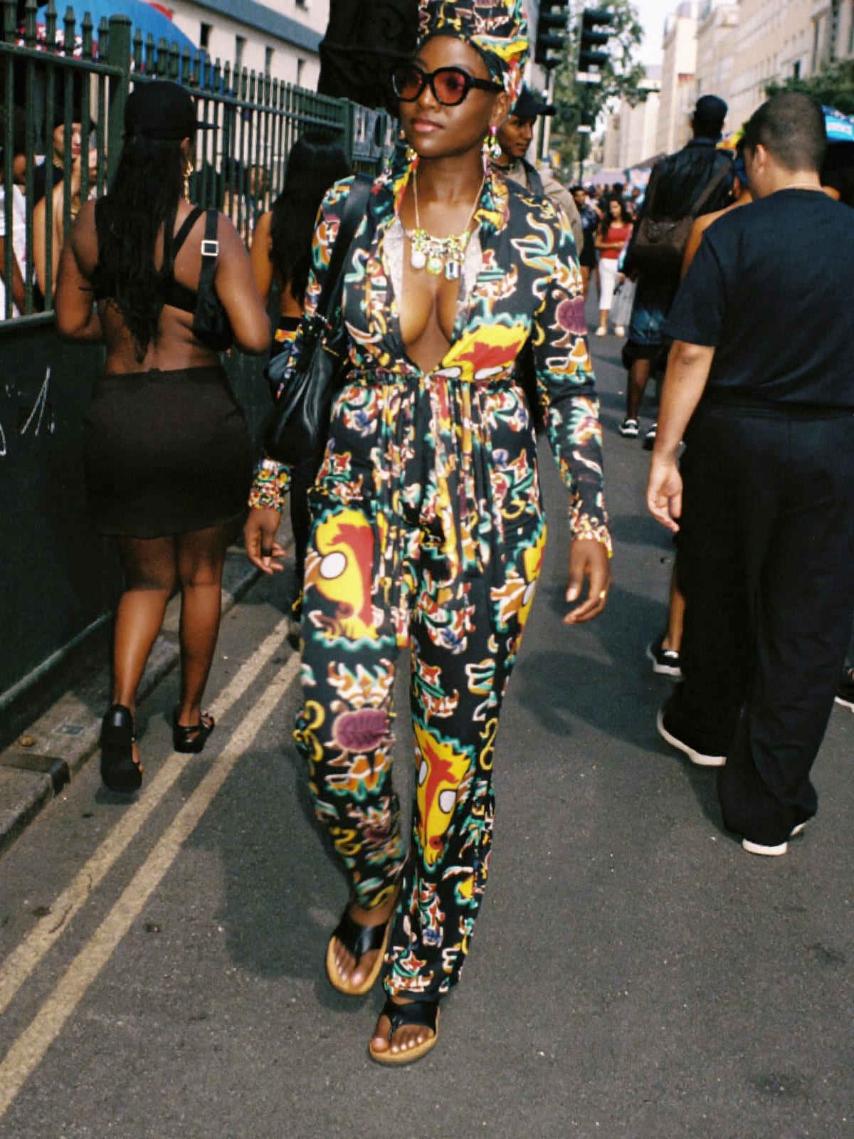 Afro Print Statement outfit for Nice Carnival: printed co-ord set, open shirt or wrap top, leather sandals or slides