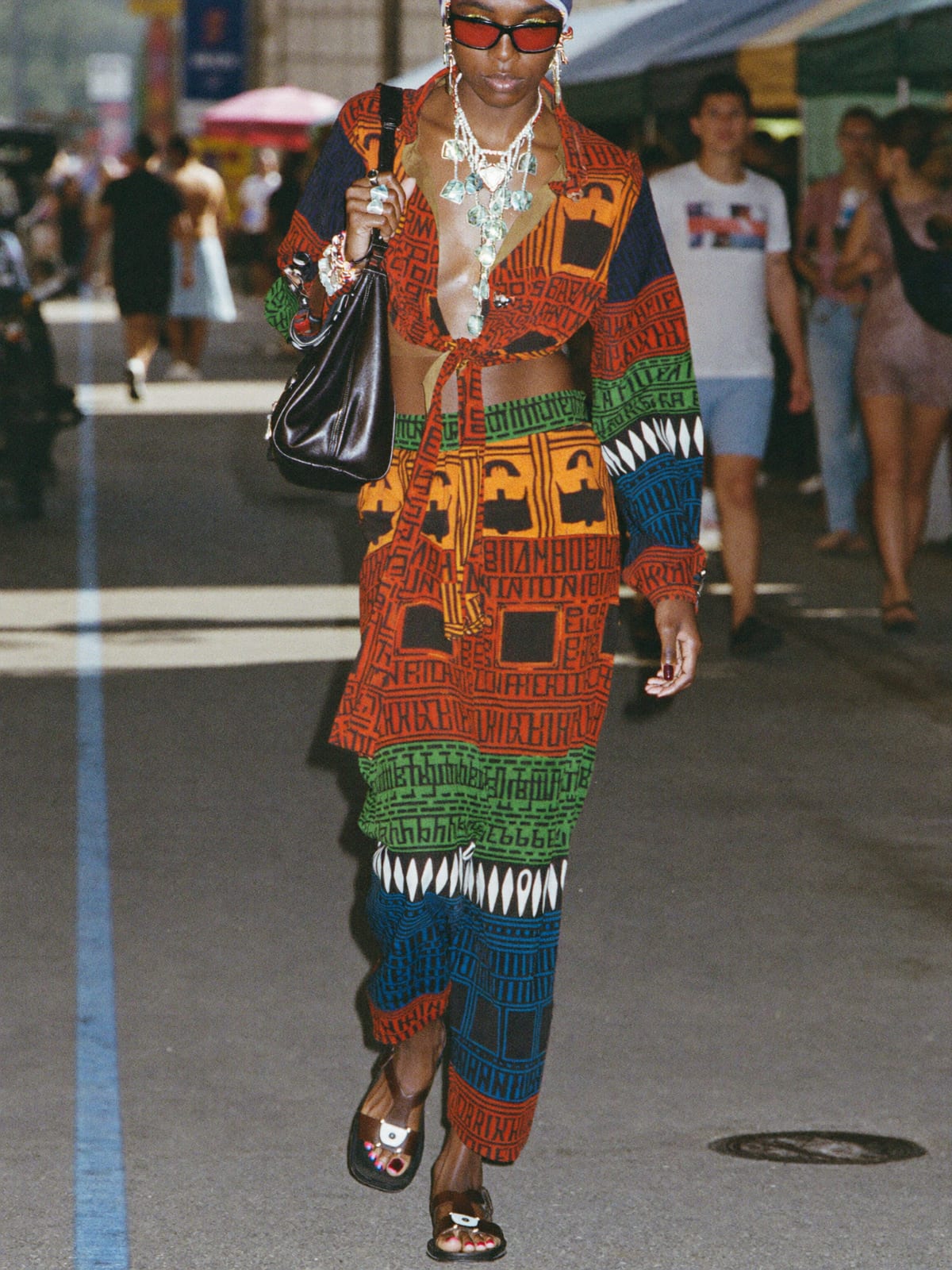 Afro Print Statement outfit for Oktoberfest: printed co-ord set, open shirt or wrap top, leather sandals or slides
