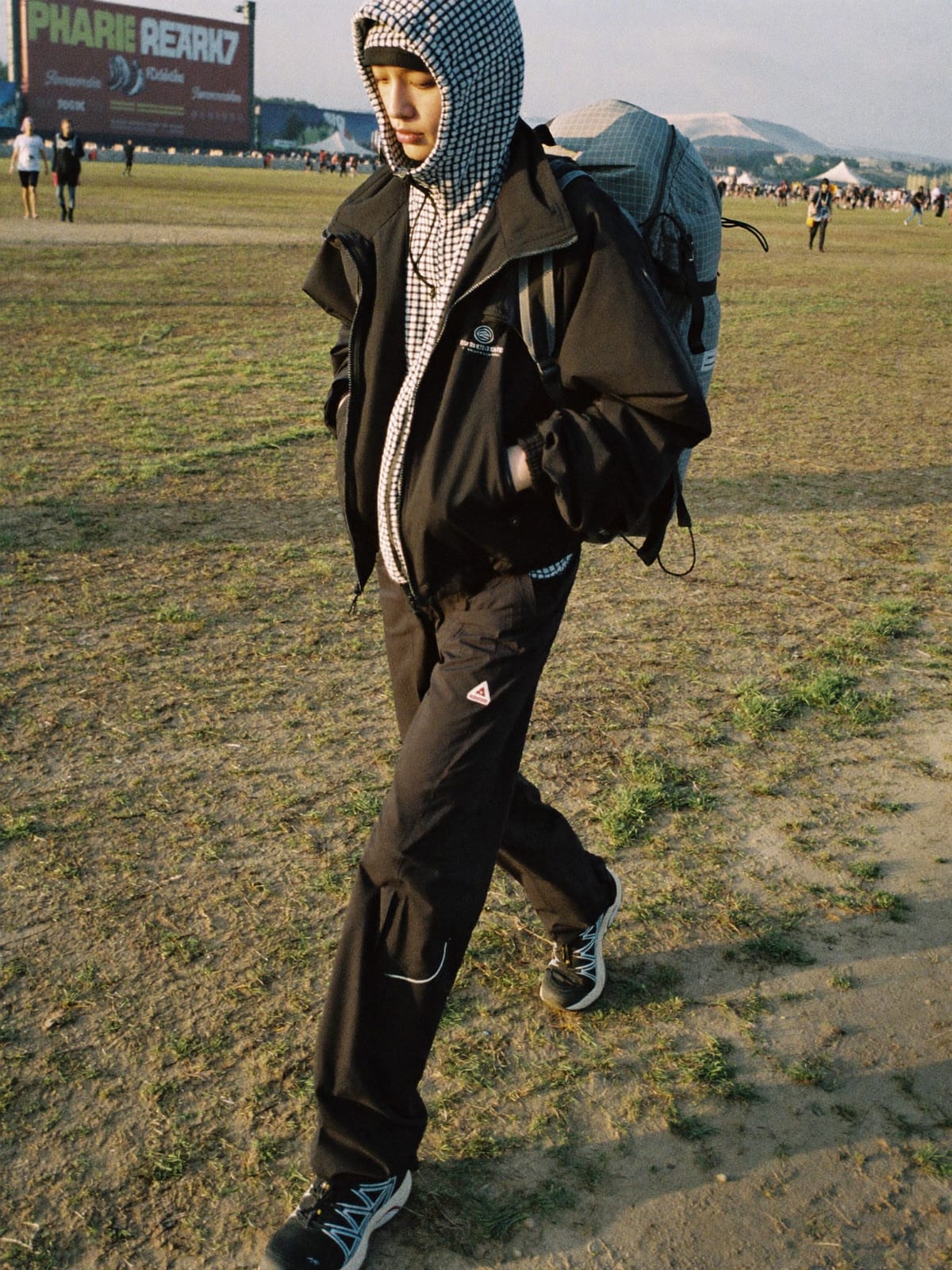 Gorpcore Utility outfit for Pol’and’Rock Festival: technical waterproof shell, utility trousers, trail runners