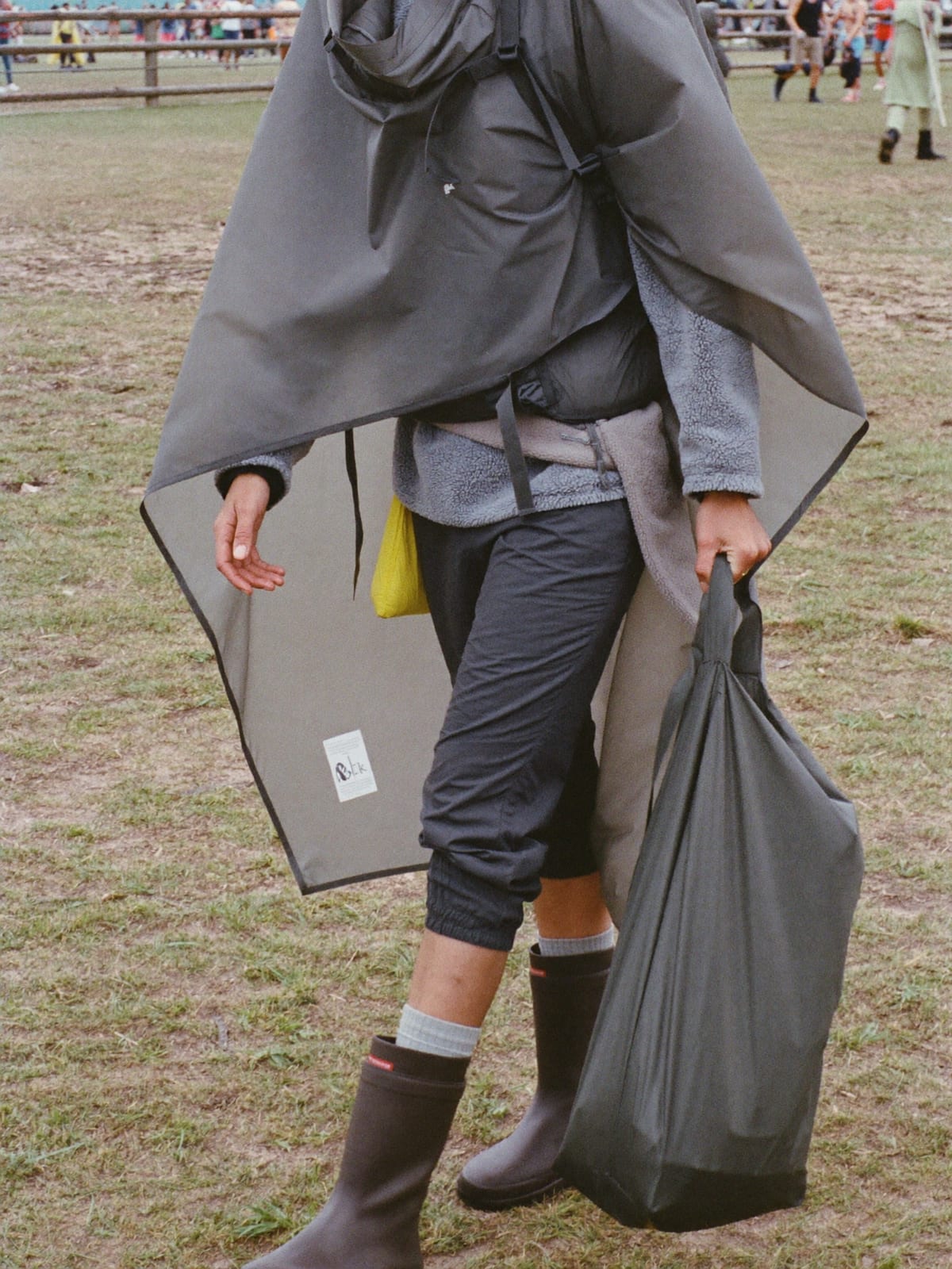 Mud-Proof Practical outfit for Pol’and’Rock Festival: waterproof poncho, wellington boots with thick socks, fleece mid-layer