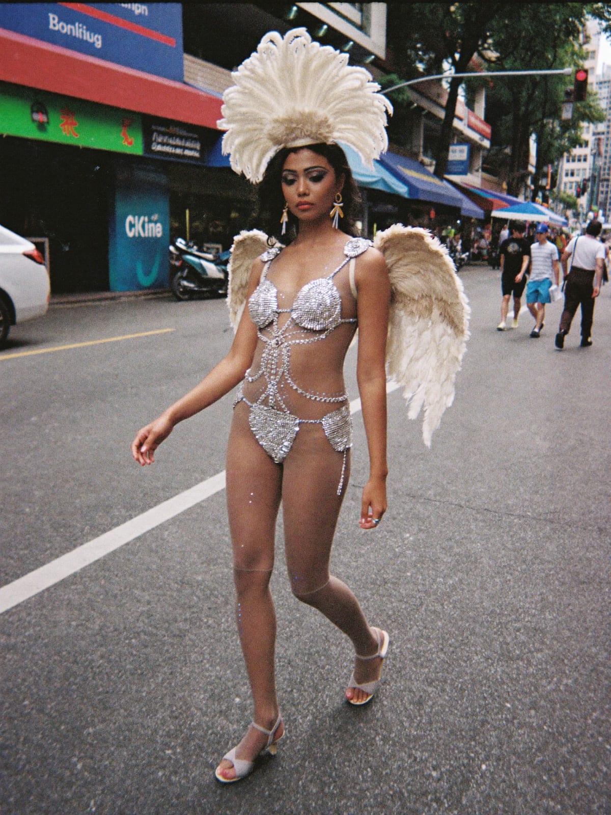 Carnival Feathers outfit for Songkran Bangkok: feather headpiece and wings, sequin bodysuit, body gems and glitter
