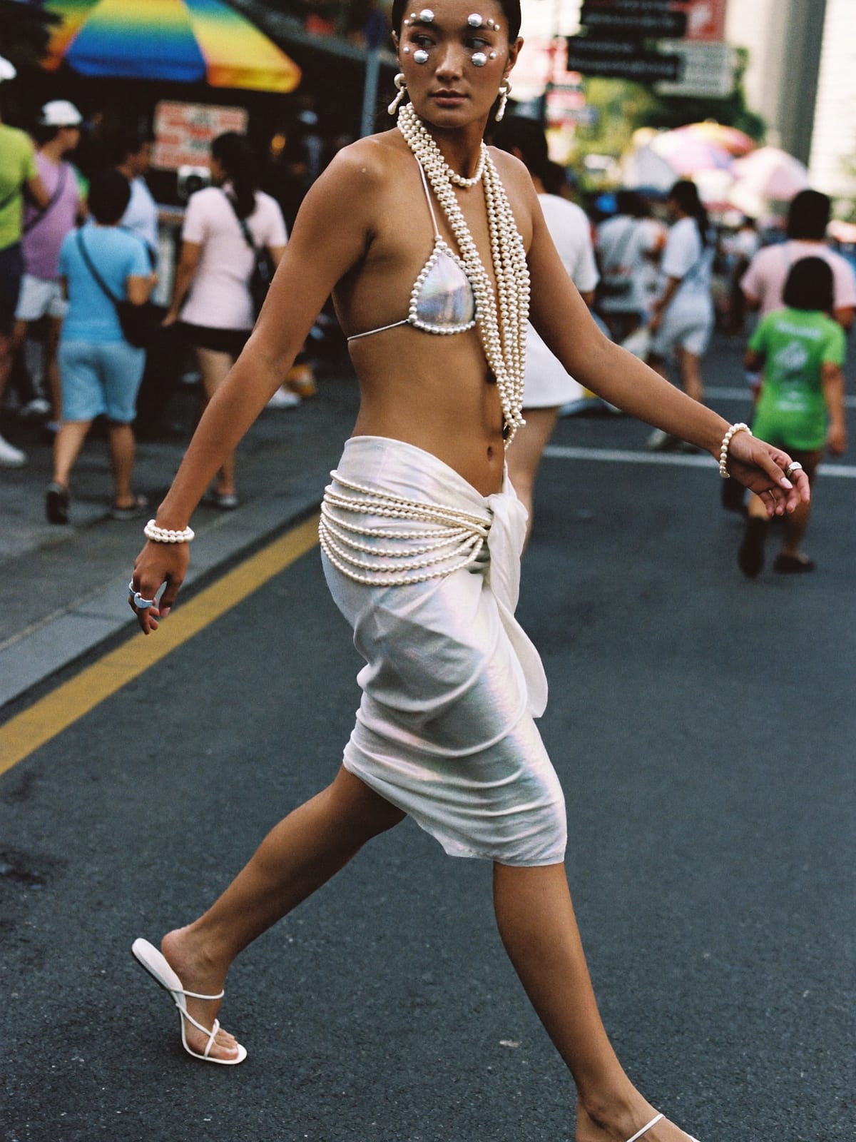 Mermaidcore outfit for Songkran Bangkok: shell or pearl-trim top, iridescent sarong or skirt, strappy flat sandals