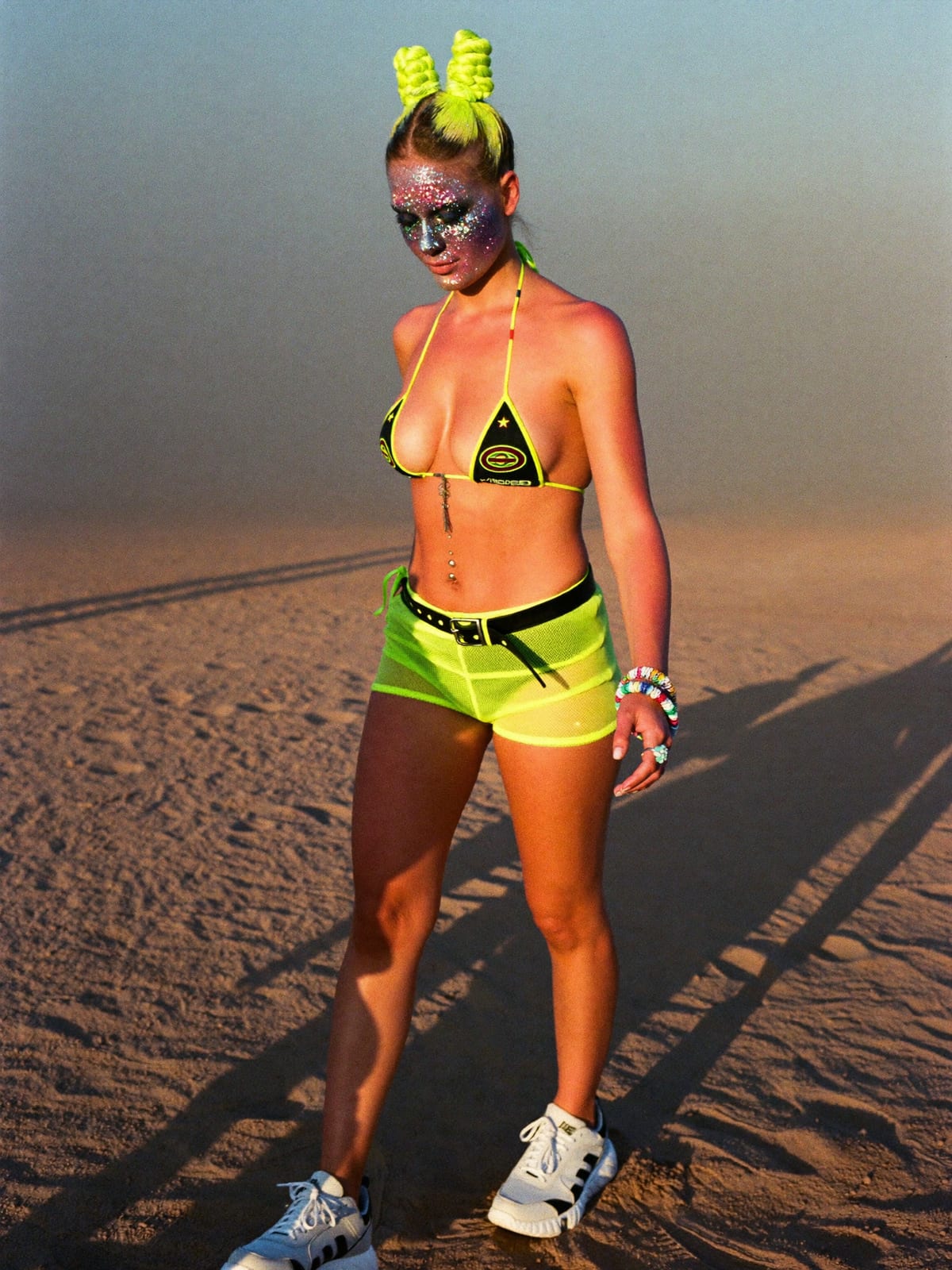 Neon Rave outfit for MDLBEAST Soundstorm: UV-reactive bikini top or bodysuit, neon shorts or mesh skirt, chunky white trainers