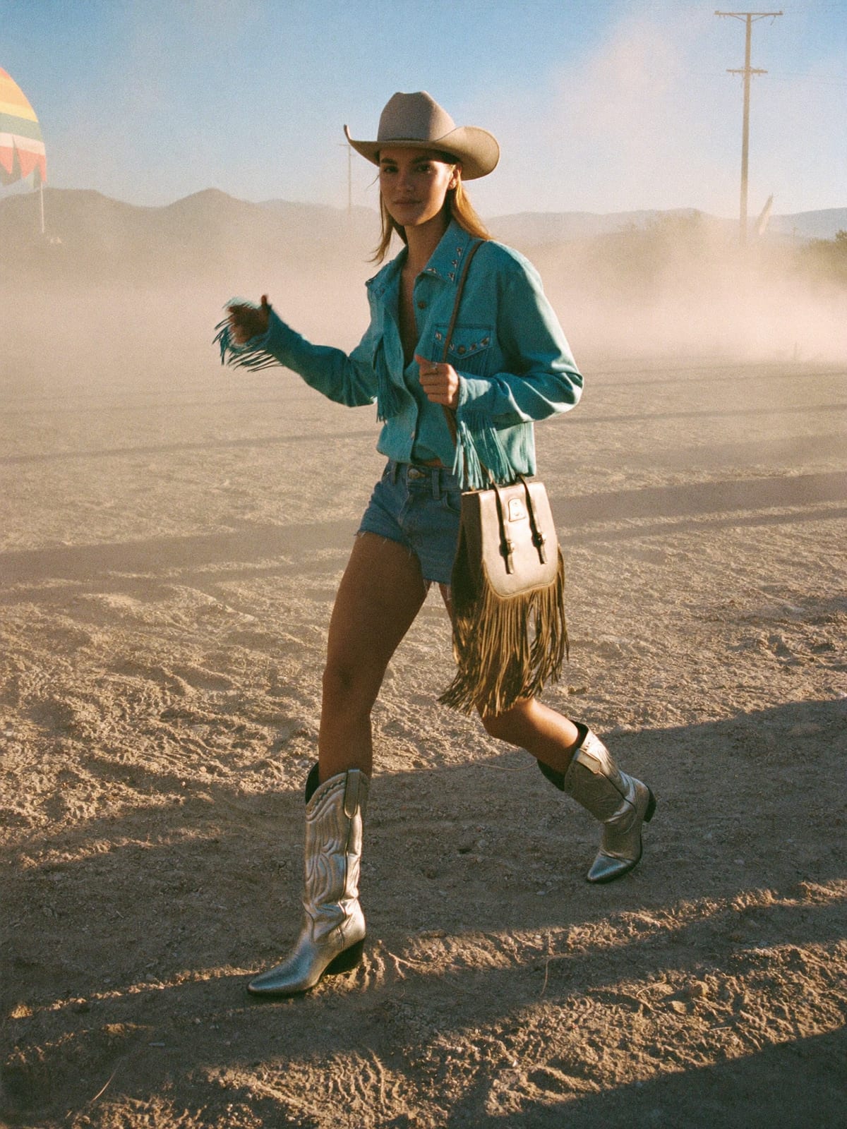 Cowboy Core outfit for Stagecoach: straw or felt cowboy hat, western shirt or fringed top, denim shorts or straight jeans