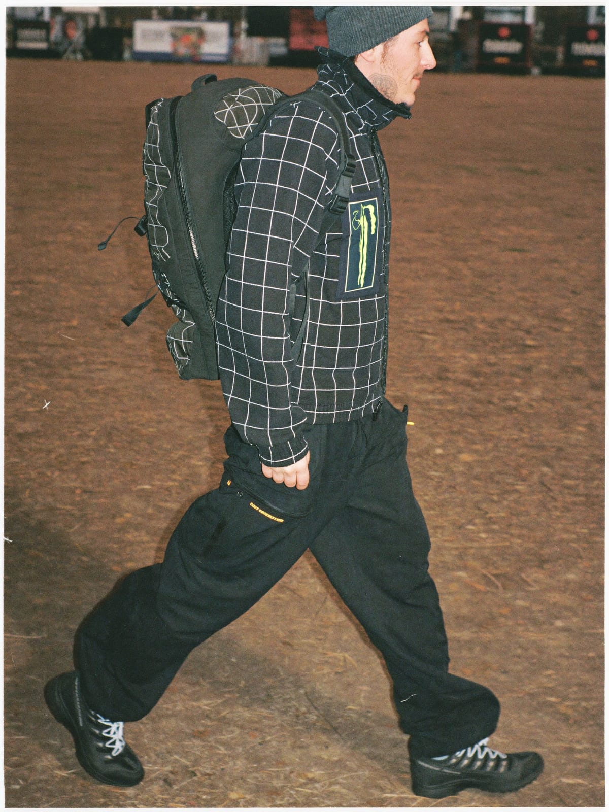 Gorpcore Utility outfit for Tomorrowland: technical waterproof shell, utility trousers, trail runners