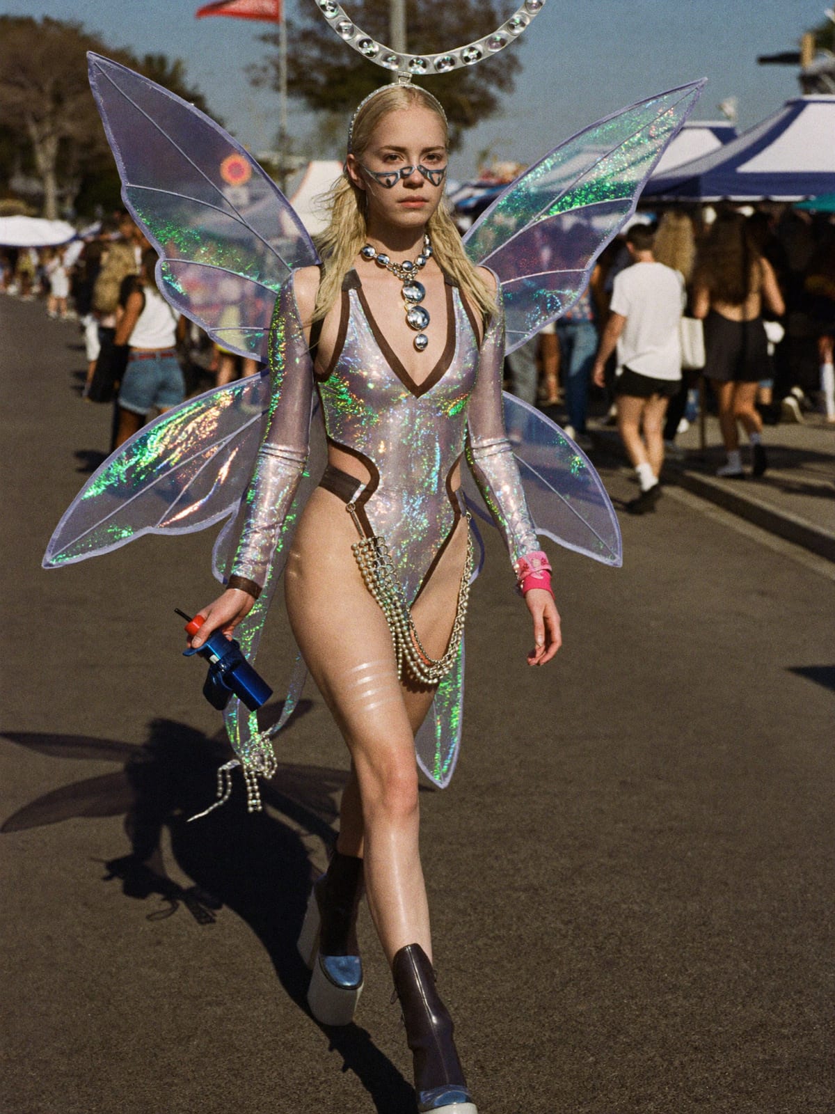 Cyber Fairy outfit for Ultra Music Festival: holographic bodysuit, fairy wings or light-up halo, platform boots