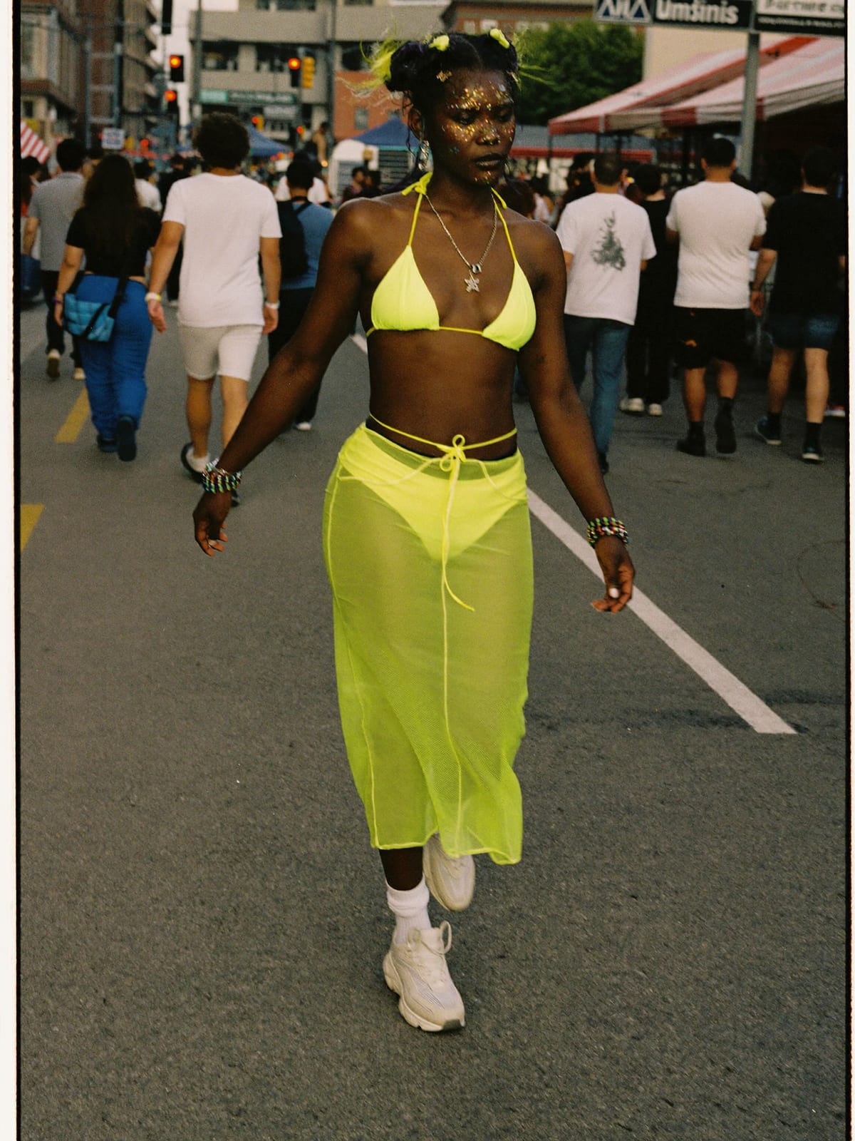 Neon Rave outfit for Ultra Music Festival: UV-reactive bikini top or bodysuit, neon shorts or mesh skirt, chunky white trainers