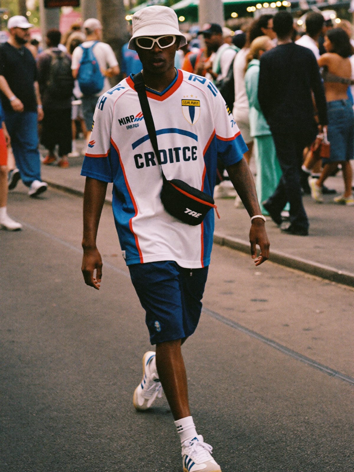 Jersey Core outfit for Ultra Music Festival: retro football or racing jersey, mesh or nylon shorts, terrace trainers