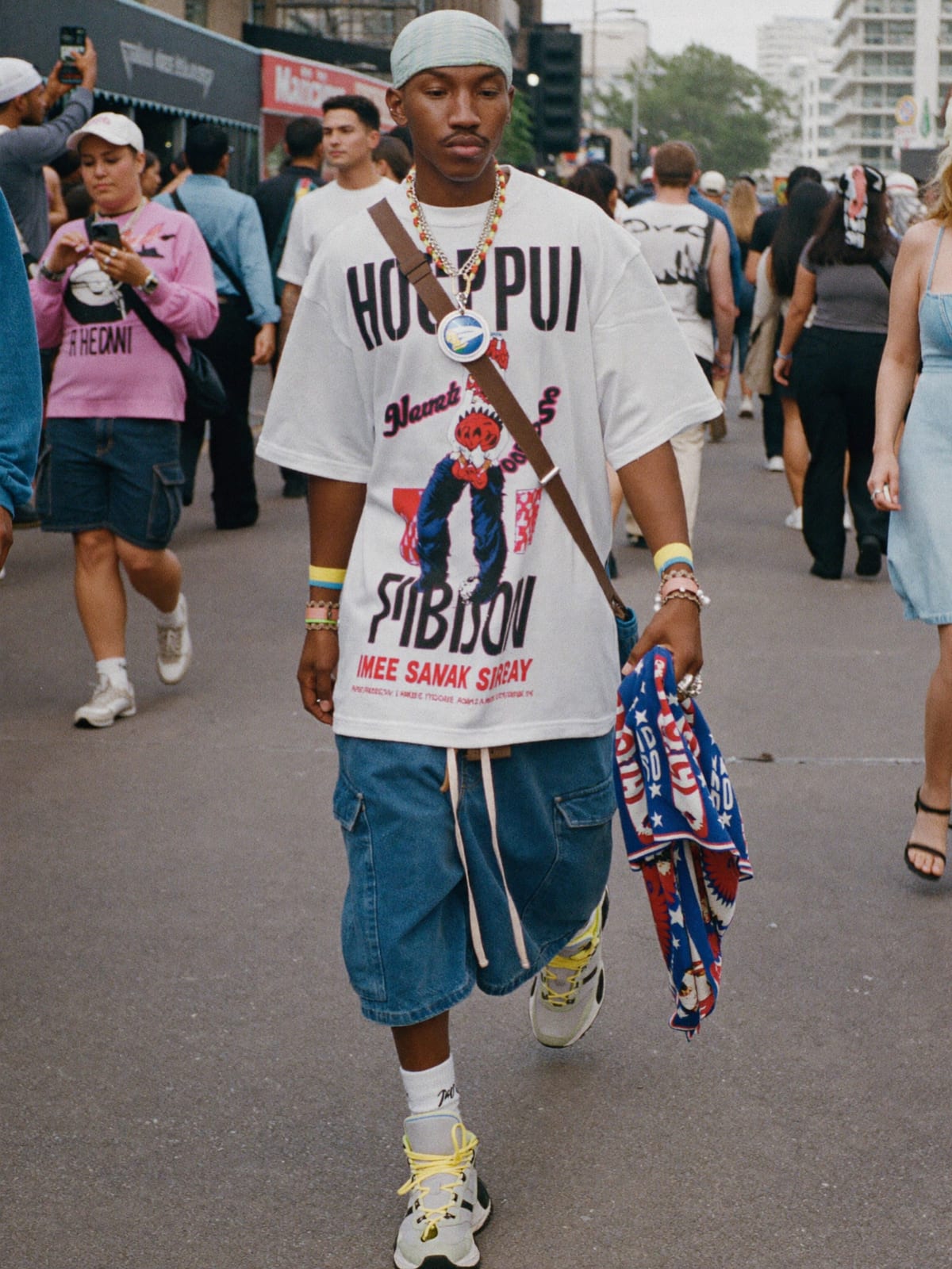 Street Heat outfit for Ultra Music Festival: oversized graphic tee or jersey, baggy denim or cargo shorts, statement sneakers